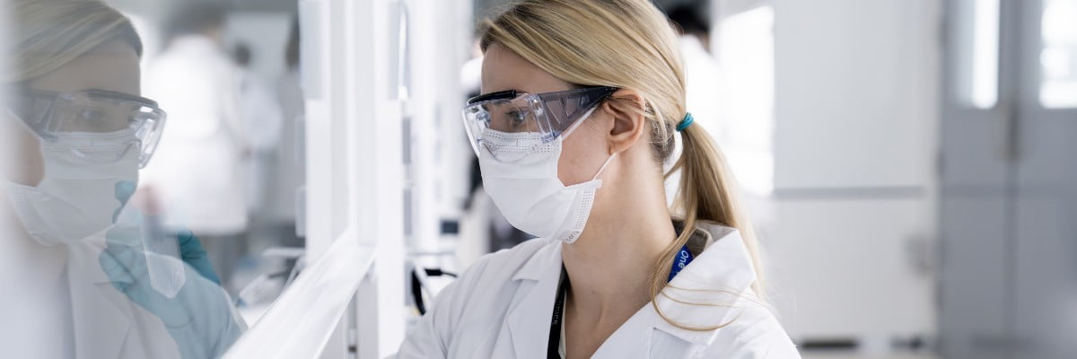 Researcher looking into the lab