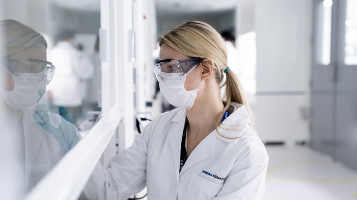 Researcher looking into the lab