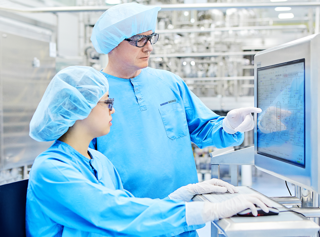 Samsung Biologics employees inspecting biopharmaceutical production facilities